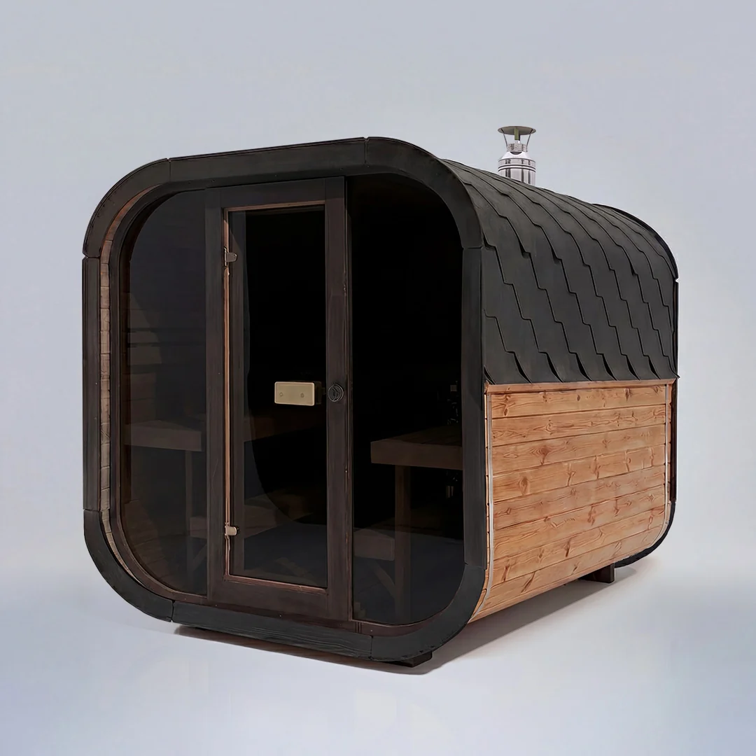 The sauna at Back of the Box — tiered benches and heater in warm low light